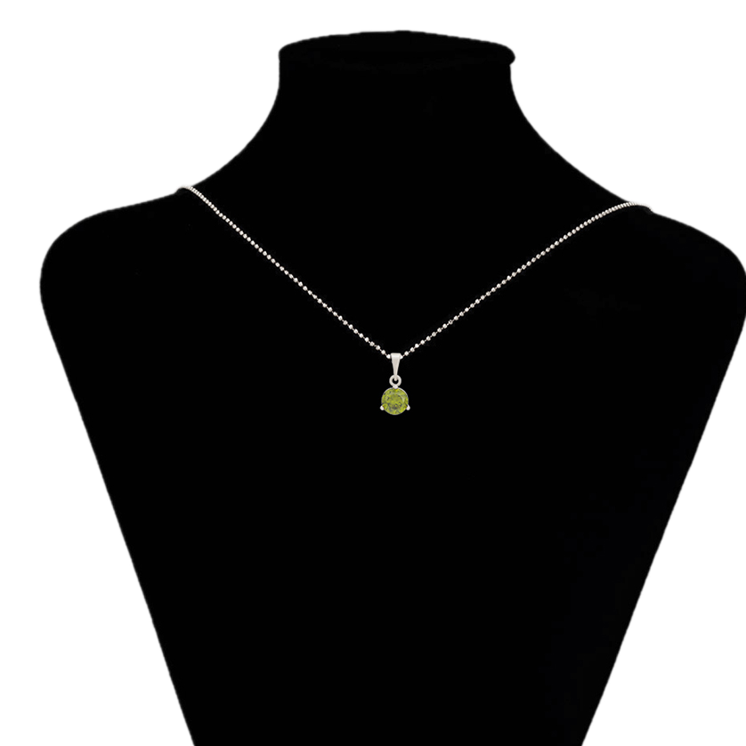 Necklace with a green pendant on a black mannequin bust, brand 'Xuping' visible.