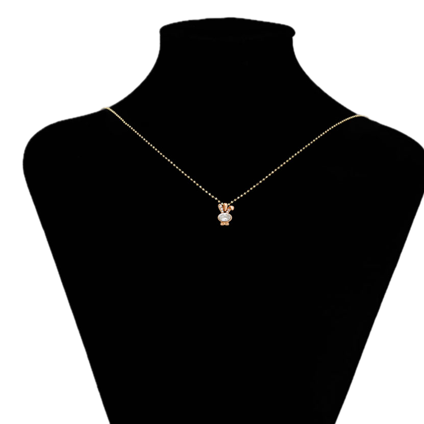 Gold necklace with a small pendant on a black mannequin bust, brand 'Xuping' visible.