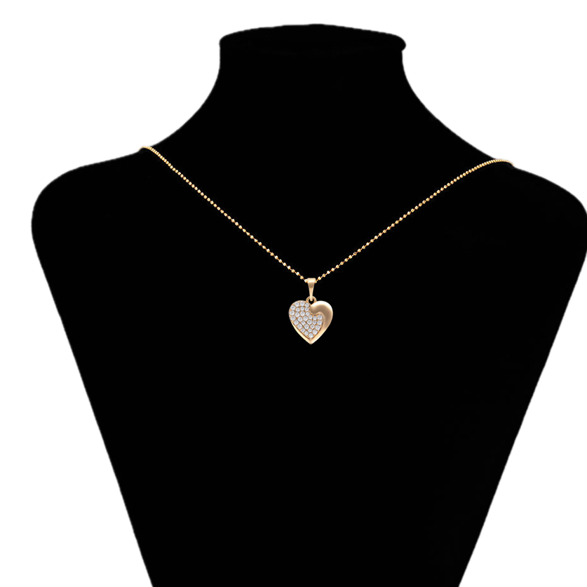 Gold heart-shaped necklace on a black mannequin bust with 'www.xupin.com' branding.