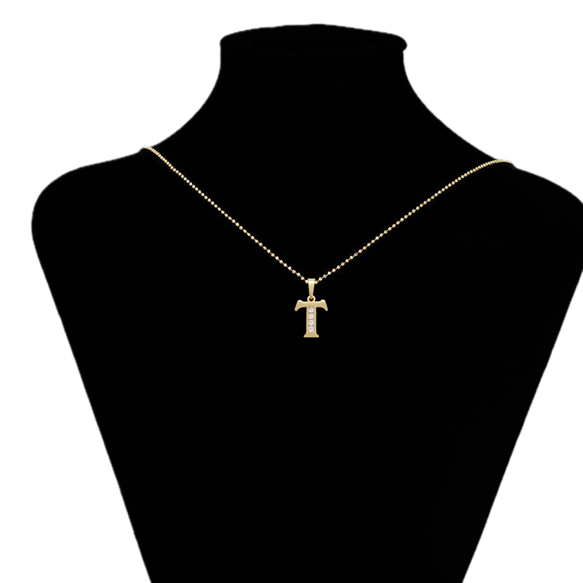 Gold necklace with a cross pendant on a black mannequin bust, branded 'Xupin'.