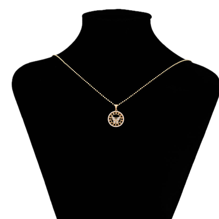 Gold necklace with a pendant on a black mannequin bust, branded 'Xuping'.