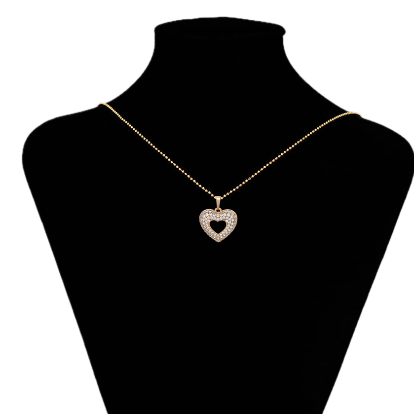 Heart-shaped pendant necklace on a black mannequin bust with 'www.xupix.com' branding.