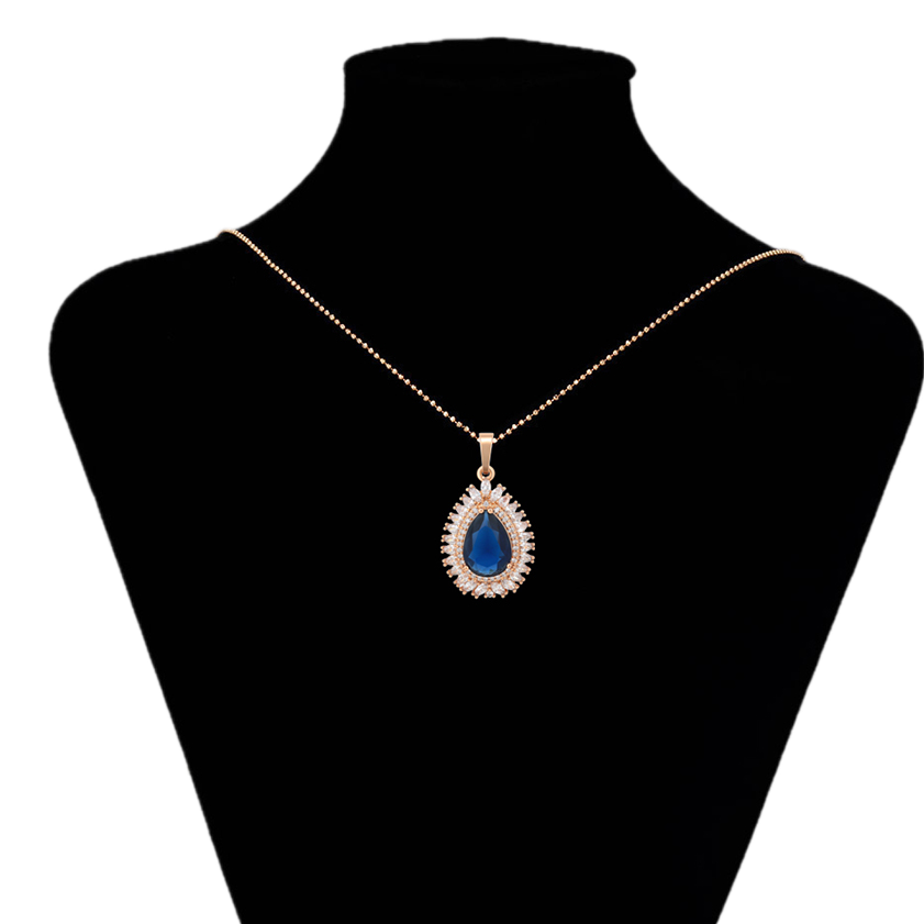 Necklace with a blue teardrop pendant on a black mannequin bust, brand 'Xuping' visible.